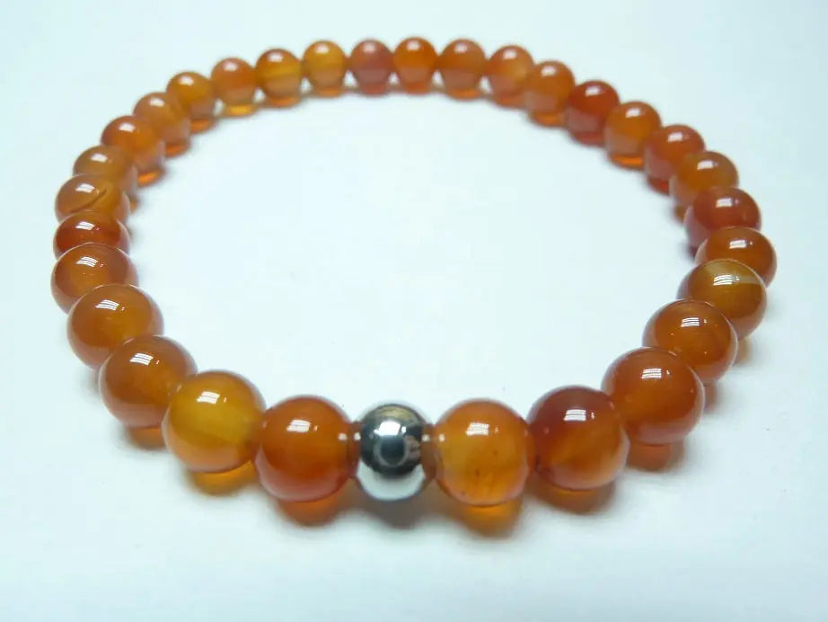 bracelet en cornaline naturelle perles rondes orange monté sur fil élastique robuste pour énergie et confiance
