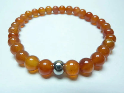 bracelet en cornaline naturelle perles rondes orange monté sur fil élastique robuste pour énergie et confiance