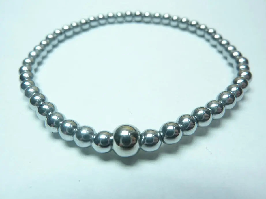 Bracelet en hématite naturelle qualité AAA en perles rondes montées sur fil élastique, bijou protecteur et équilibrant pour homme et femme.