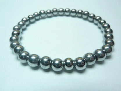 bracelet en hématite naturelle perles brillantes monté sur fil élastique robuste collection mixte bienfaits lithothérapie