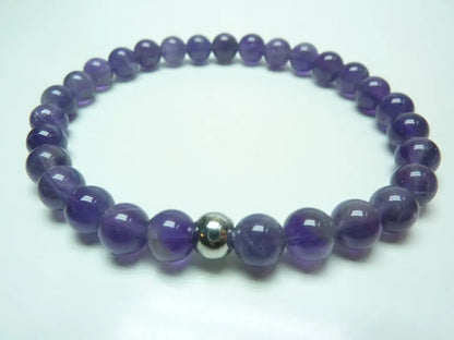 Bracelet en améthyste naturelle violette à perles rondes monté sur élastique solide pour apaiser stress et favoriser sérénité