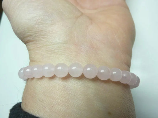 Bracelet en quartz rose naturel perles rondes monté sur fil élastique, apaisant et énergisant pour l'amour et la douceur.